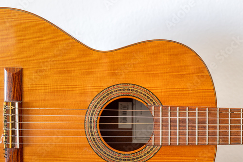 Detail of classical acoustic guitar with strings and sound hole