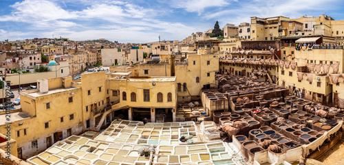 фотографія Chouara tannery in fez, morocco showing traditional leather dyeing