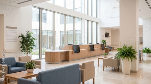 Modern hospital lobby with reception desk, comfortable seating area, and large windows