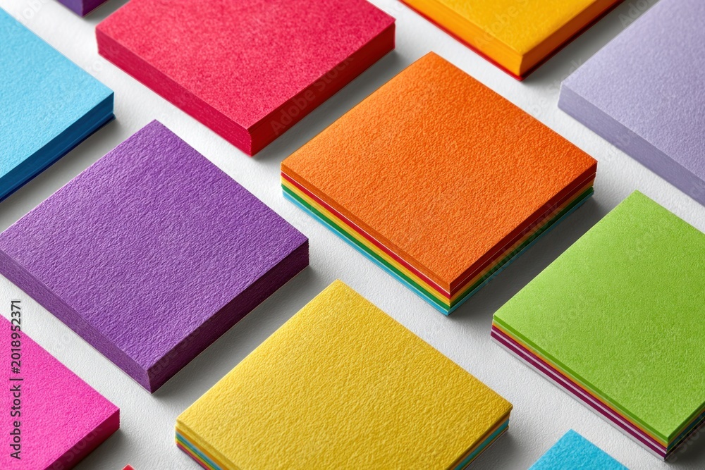 Fototapeta premium Vibrant Stacks of Colored Paper Blocks
