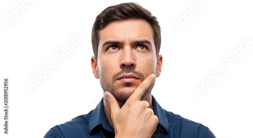 Man in blue shirt looking thoughtful with finger on chin isolated on white background