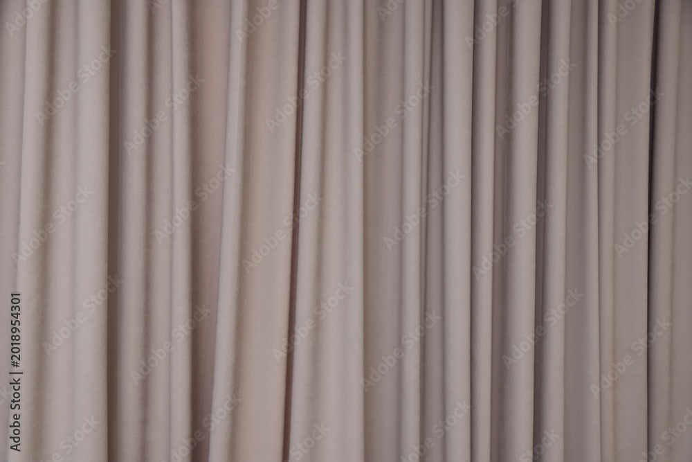 Fototapeta premium Stylish dark beige curtains as background, closeup