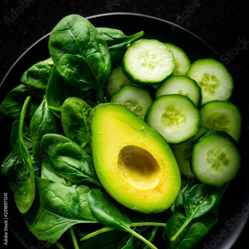 Fresh Spinach and Cucumber Salad With Sliced Avocado