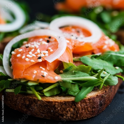 Salmon Dish With Onion and Arugula on Bread During Daylight Hours