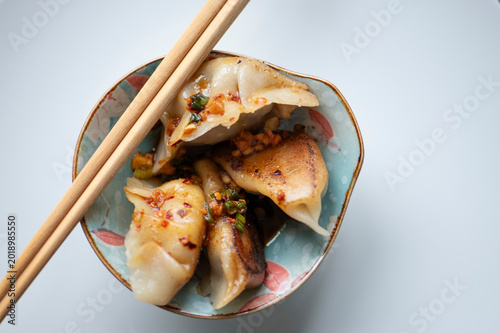 High angle shot of handmade Chinese Jiaozi dumplings, gluten-free version, authentic Asian cuisine, Pan-fried
