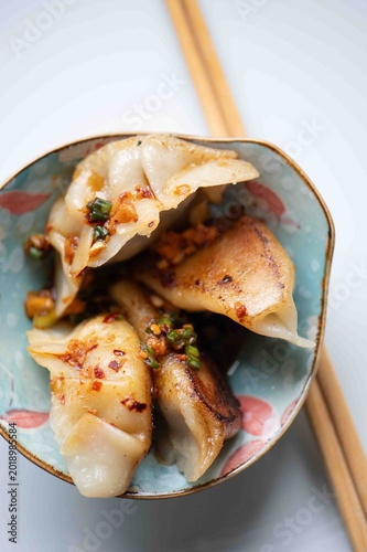 High angle shot of handmade Chinese Jiaozi dumplings, gluten-free version, authentic Asian cuisine, Pan fried