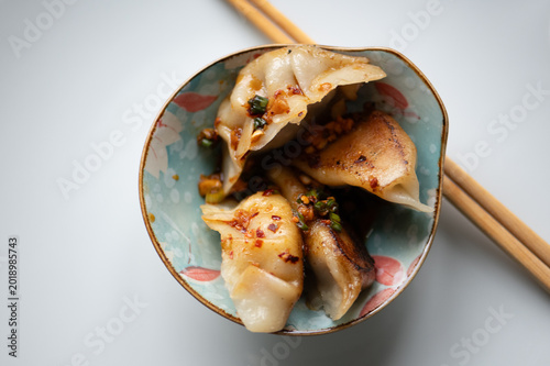 High angle shot of handmade Chinese Jiaozi dumplings, gluten-free version, authentic Asian cuisine, Pan-fried