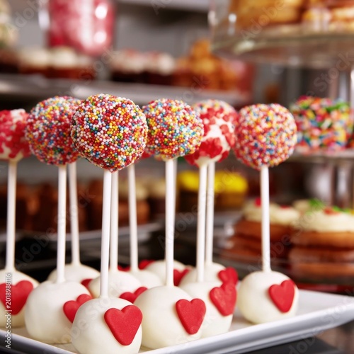 Brightly Decorated Cake Pops on Display in a Bakery During a Festive Event