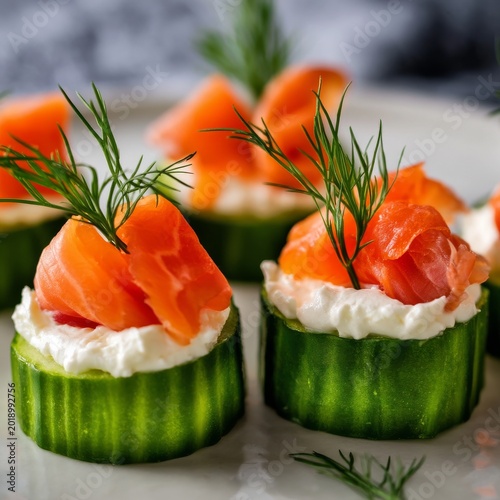 Cucumber Slices Topped With Cream Cheese and Smoked Salmon Served on a White ...