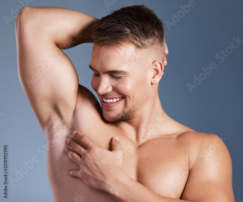 Foto Beauty, smile and underarm of man in studio for masculine grooming, hygiene or wellness