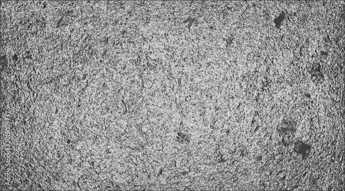 Foto A close-up shot of a textured, mottled surface, with specks throughout