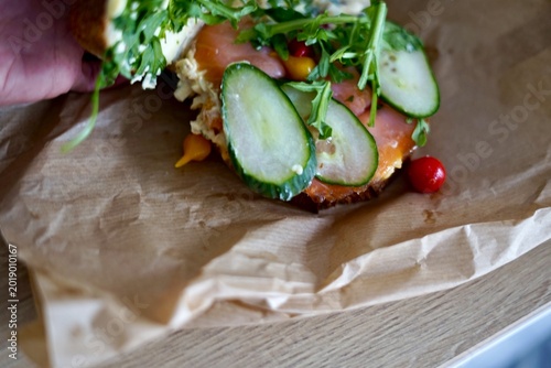 Casual Fish Sandwich. Simple Open Sandwich Featuring Smoked Salmon And Crisp Vegetables On Wholegrain