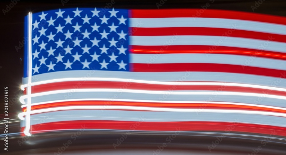 Fototapeta premium American flag motion blur with dynamic light trails, patriotic symbol of United States pride, energetic red white and blue background for Memorial Day and national celebrations.