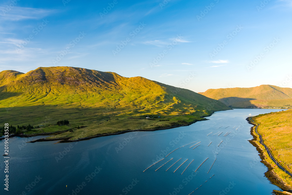 Naklejka premium Aerial view of Killary Fjord near Leenane on the Galway Mayo border, Ireland. Irelands only fjord winds through the dramatic Connemara and Mayo mountain landscape.