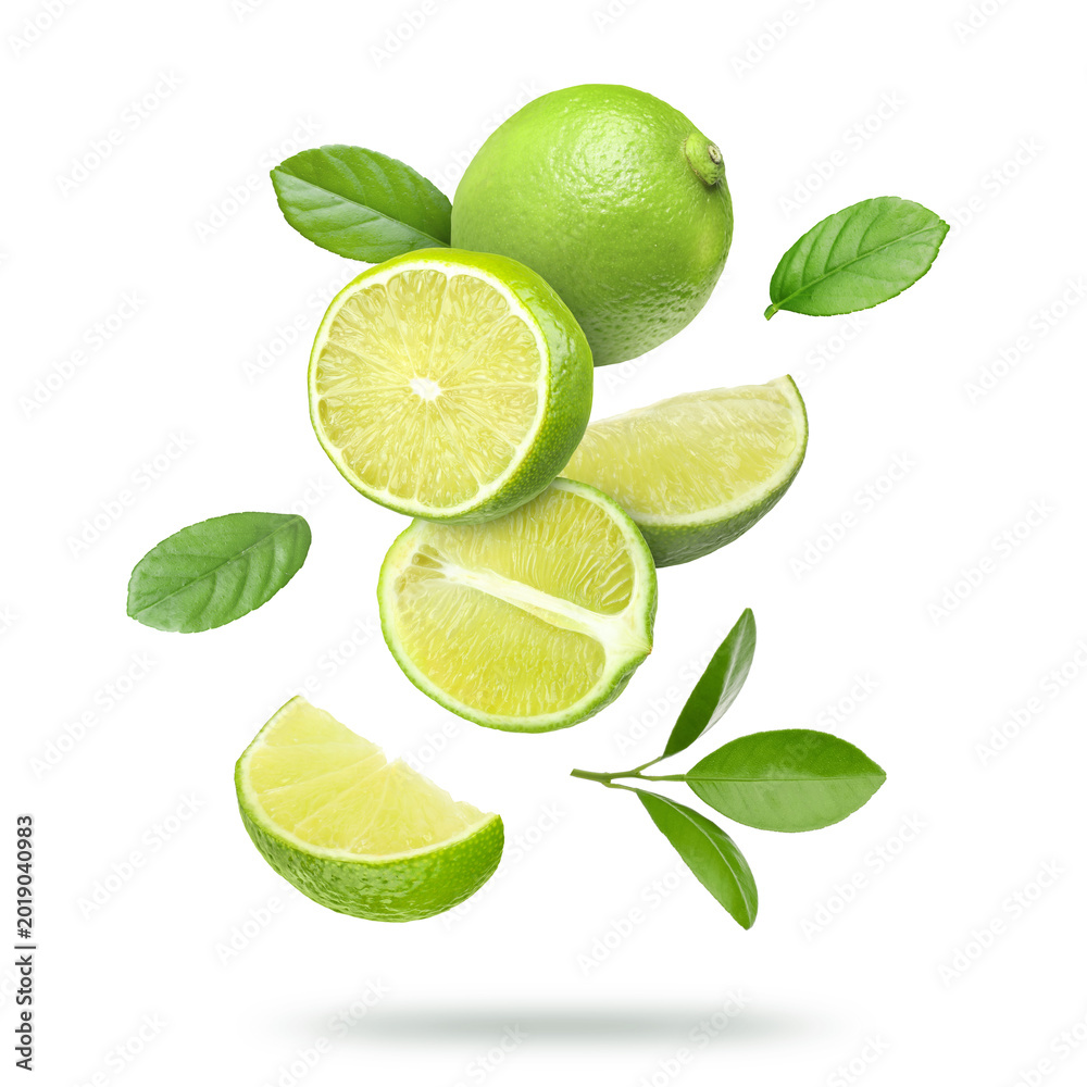 Fototapeta premium Fresh limes and green leaves falling on transparent background. Citrus fruit