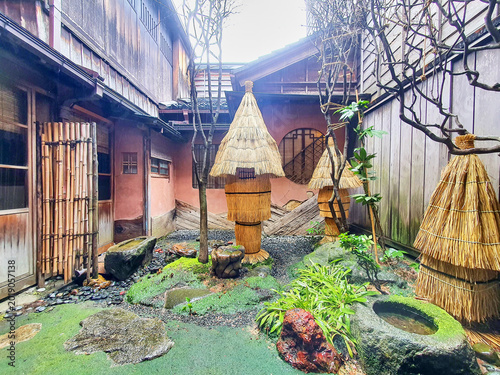 Slika na platnu A traditional Japanese courtyard garden (tsuboniwa) situated between historic wo
