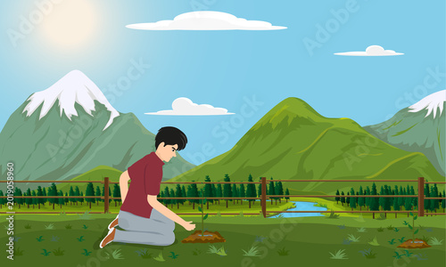 young man planting saplings in his garden