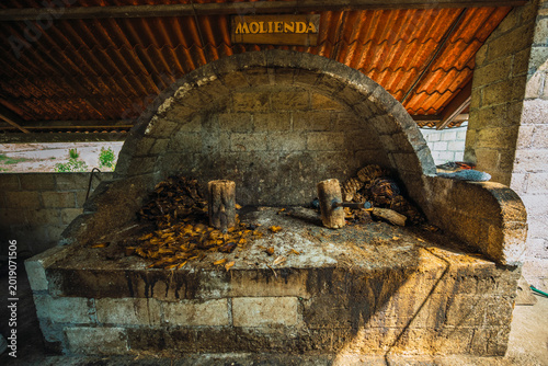 Tableau sur toile Wooden hammers for grinding with bagasse from agave hearts to make mezcal