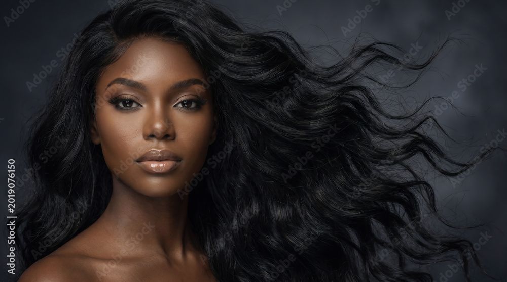 Naklejka premium Ebony black African model with side swept voluminous wavy hairstyle, beauty portrait with flowing hair movement, smooth radiant skin and elegant fashion look for Juneteenth and Black History Month