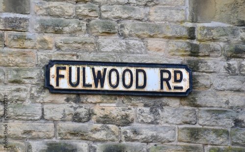 Old street sign on stone wall in Sheffield is famous Foulwood Raod