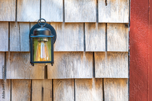 Vintage Outdoor Wall Lantern on Weathered Wood Shingle Siding