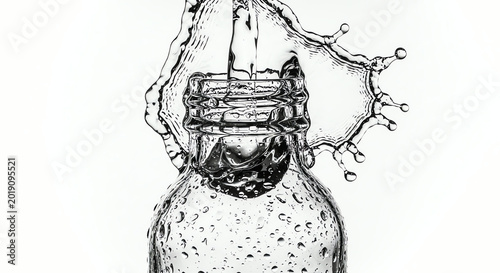 Water Splash Over Glass Bottle Close-up