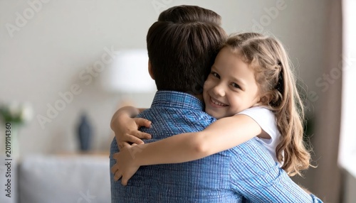 Father and daughter warm hug moment.