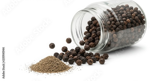 Spilled Peppercorns and Ground Spice in Glass Jar.