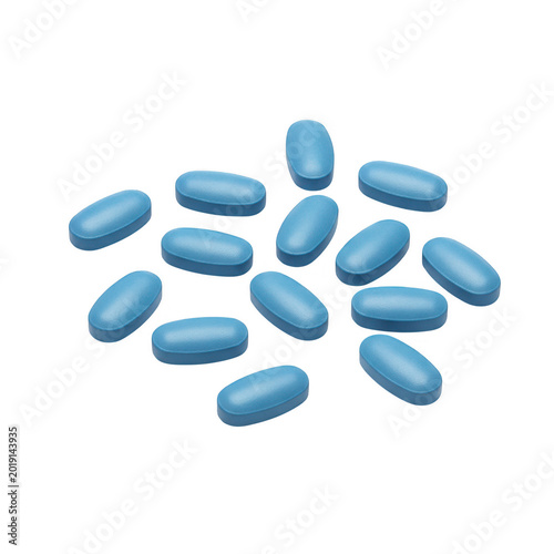 Blue oval pills scattered on surface isolated on transparent background