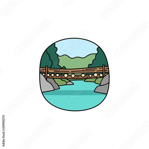 Rustic wooden bridge over a turquoise mountain river landscape