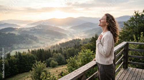Woman breathing fresh morning air at peaceful mountain view perfect for mental health wellness relaxation and freedom