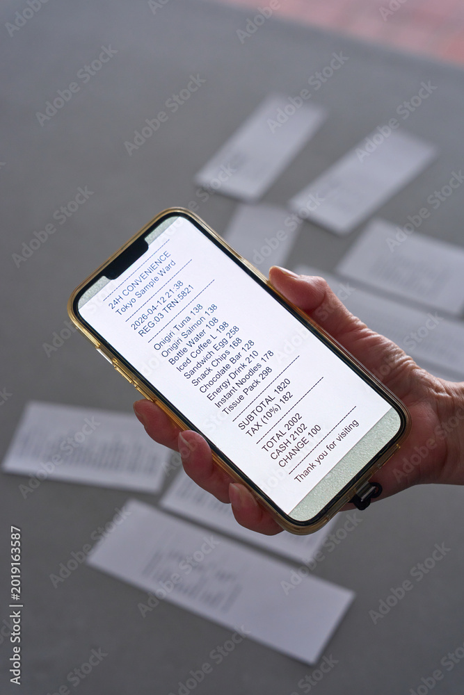 Fototapeta premium Multiple receipts scattered on gray concrete surface