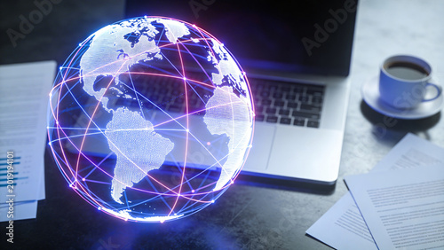 Businessman interacting with a glowing digital globe and network connections on a laptop