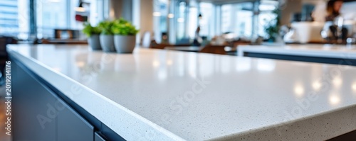 Sleek modern kitchen counter worktop with minimalist white quartz surface for interior design background and contemporary home decor