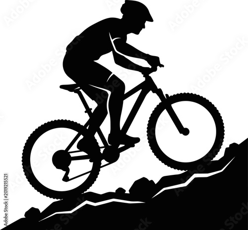 Man riding mountain bike on hill side in silhouette style