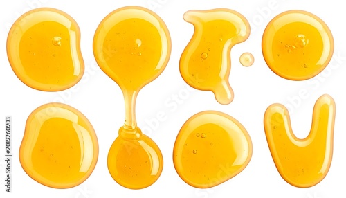 Honey drops on white background.