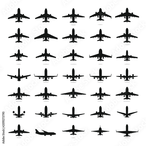 Collection of airplane silhouettes flying.