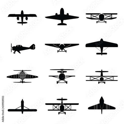 Collection of airplane silhouettes flying.