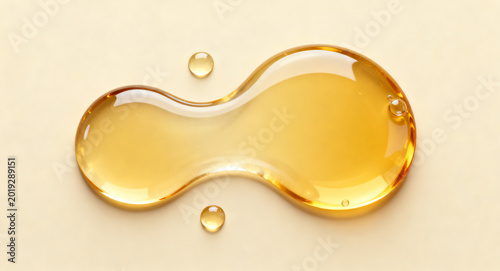 Abstract golden liquid droplet with smaller beads on a neutral background, showcasing a minimalist and elegant aesthetic