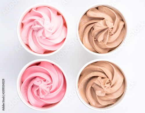 Soft serve ice cream in white cups on pure white background pink vanilla and chocolate flavors creamy dessert