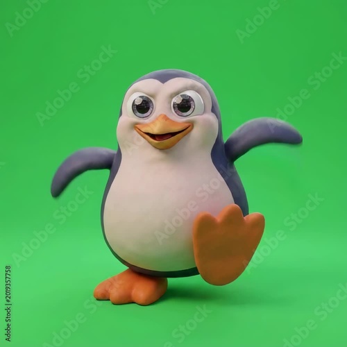 Toy Penguin Figurine on Green Screen.