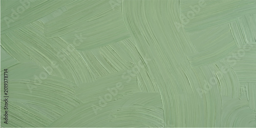 Textured light green paint brush strokes on a textured surface with brush stroke hand painted dry artistic stroke background texture background abstract painterly artistic