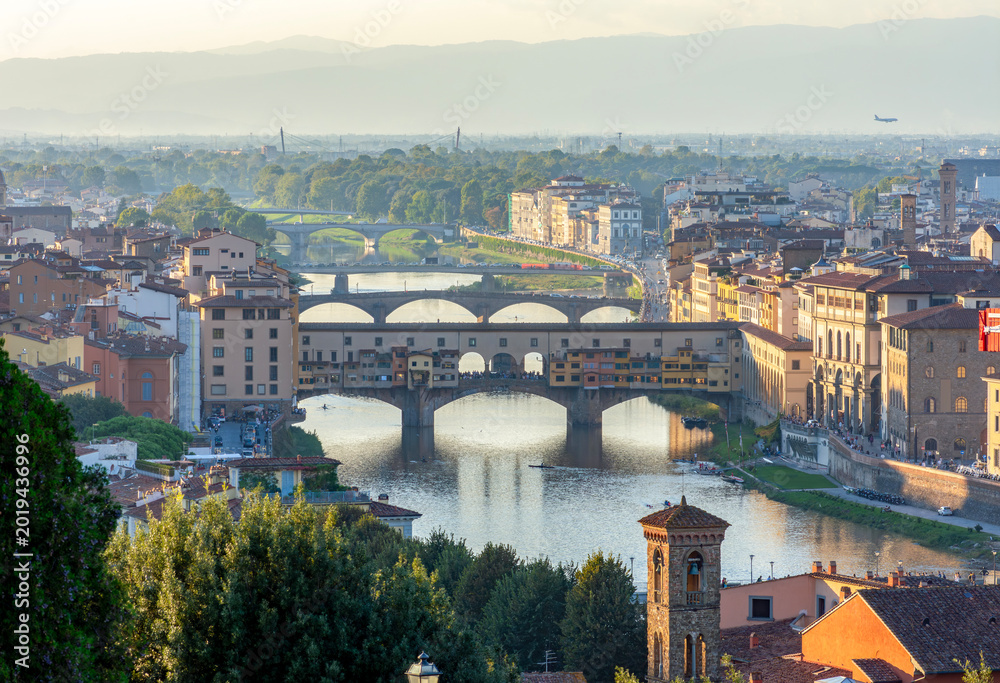 Obraz premium Ponte Vecchio bridge over Arno river at sunset, Florence, Italy