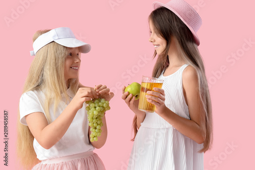 Little girls with glass of ...