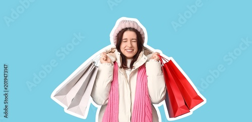 Happy young woman in warm c...