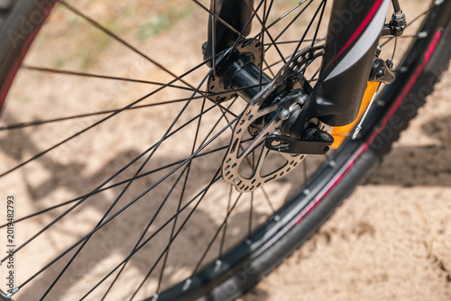 Schilderij op canvas Front wheel of a bicycle, highlighting the disc brake system