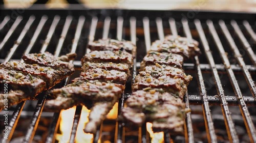 Grilled ribs with spices and sparks on barbecue