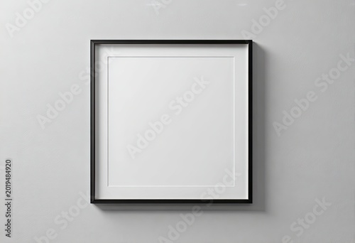 Minimalist square black frame with white mat, empty, on a plain wall