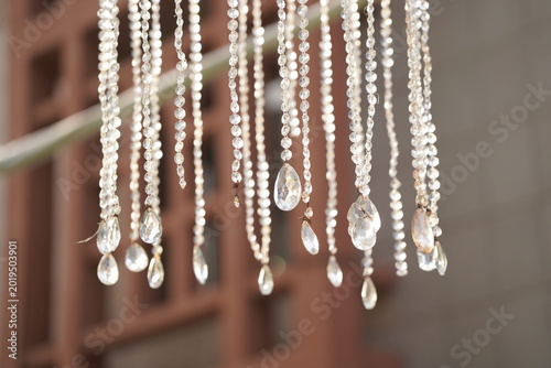 Crystal bead hanging decoration with soft bokeh background