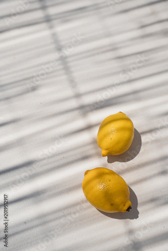 Minimalist Composition Of Ripe Lemons Under Strong Summer Sun